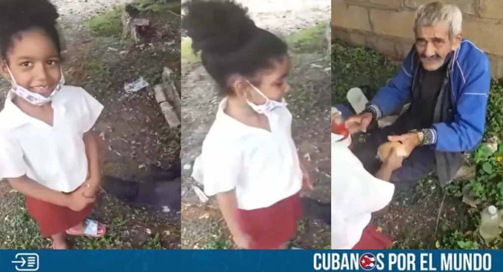 CONMOVEDOR: Niña cubana ayuda con comida a una persona sin hogar