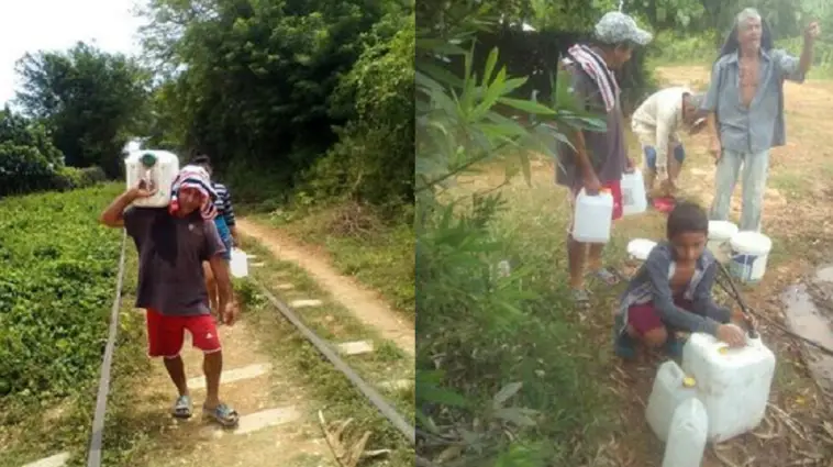 Cubanos caminan más de un kilómetro diariamente cargando agua para su casa