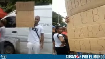 Un joven cubano se armó de valentía y se plantó con un cartel con el que pedía libertad para Cuba en una feria de alimentos ante la mirada de las personas que transitaban por el lugar.